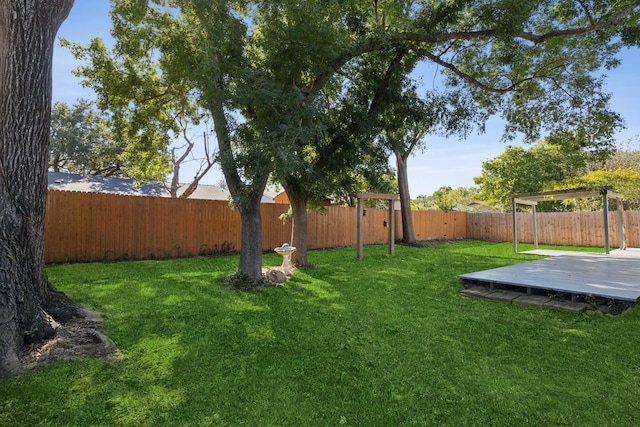 view of yard featuring a wooden deck