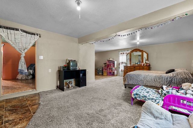 carpeted bedroom with a textured ceiling