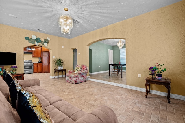 living room featuring an inviting chandelier