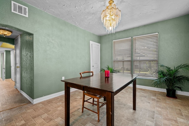 dining room with a chandelier