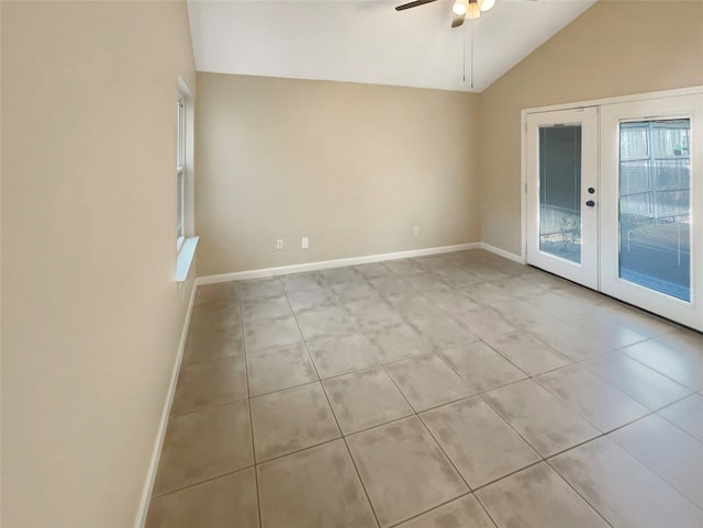 unfurnished room featuring french doors, light tile patterned floors, high vaulted ceiling, and ceiling fan