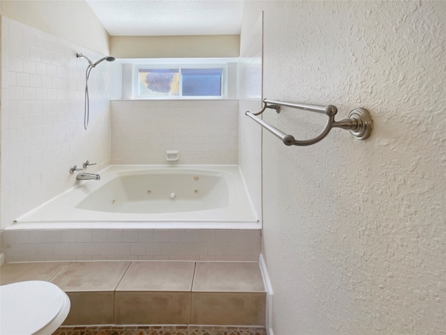 bathroom with a textured ceiling and toilet