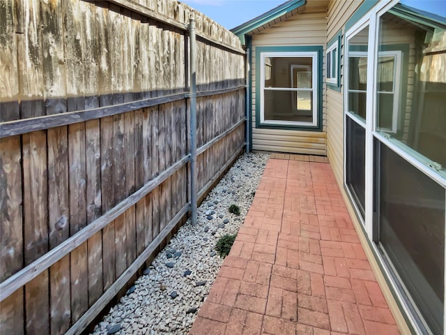 view of property exterior featuring a patio area