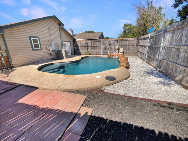 view of pool featuring central AC and a patio area