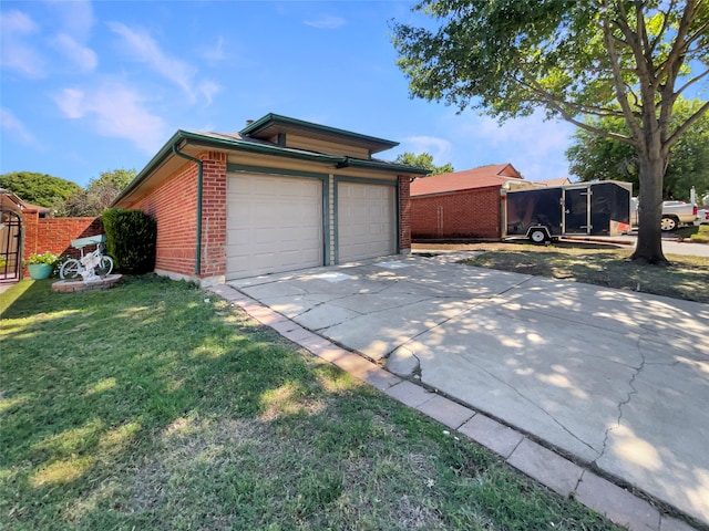 garage featuring a lawn