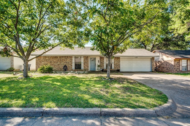 single story home with a front yard and a garage