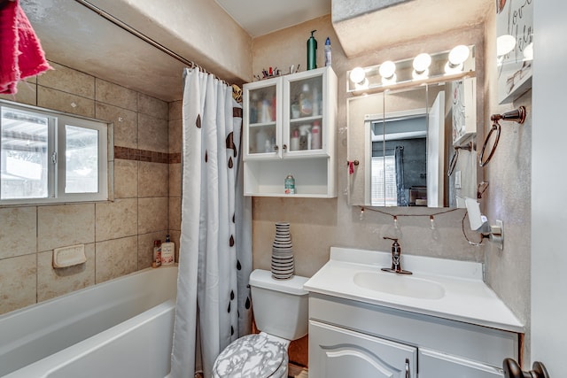 full bathroom with shower / bath combo with shower curtain, vanity, and toilet