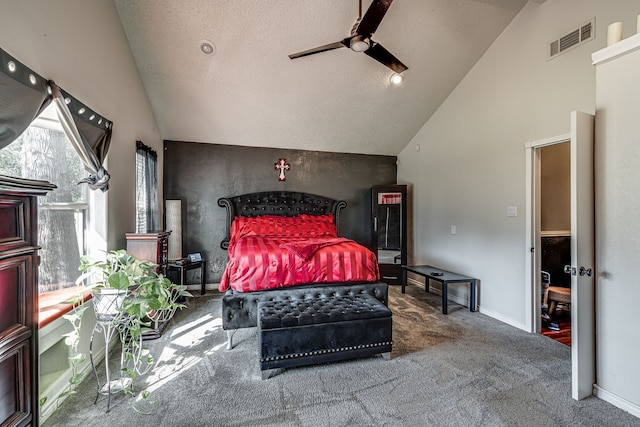 carpeted bedroom featuring ceiling fan, a textured ceiling, and vaulted ceiling