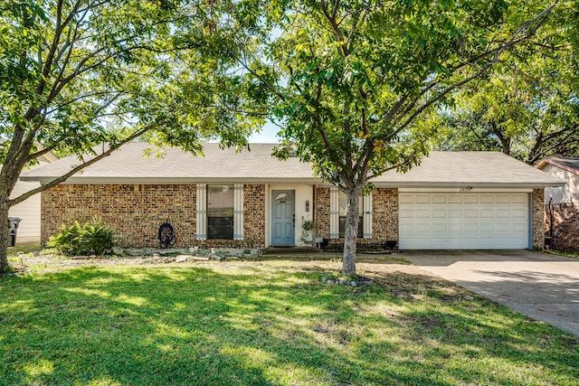 ranch-style home with a garage and a front yard