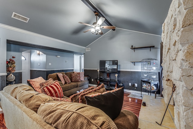 living room with wood-type flooring, lofted ceiling with beams, crown molding, and ceiling fan