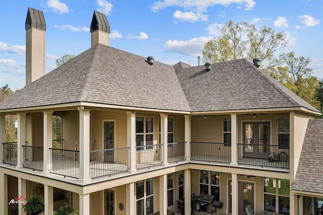 rear view of house featuring a balcony