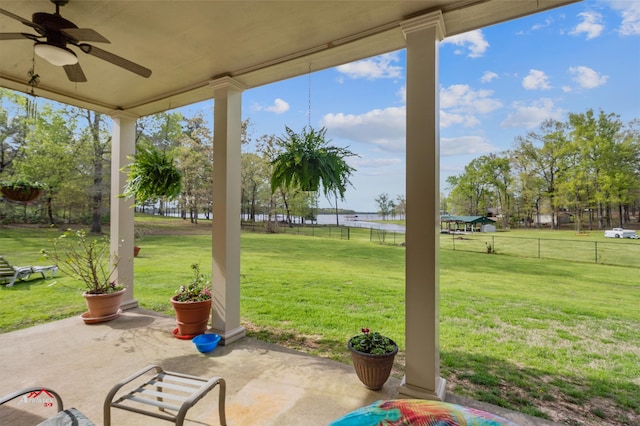 view of yard with ceiling fan and a patio area