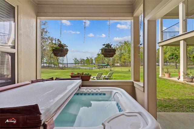 sunroom / solarium with a wealth of natural light and a jacuzzi