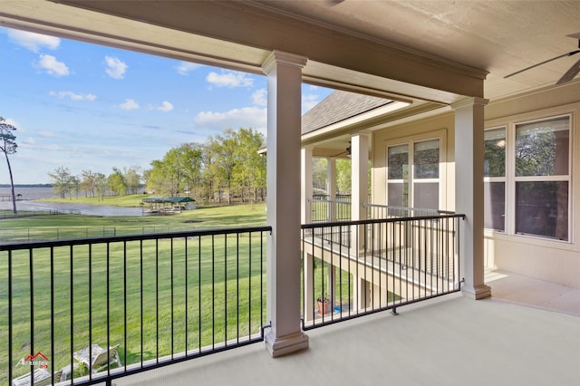 unfurnished sunroom featuring a water view