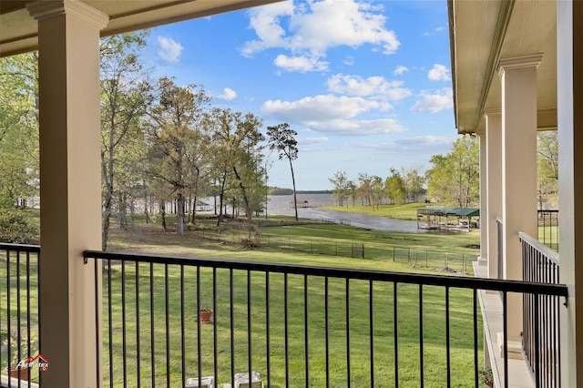 balcony featuring a water view