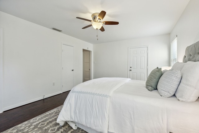 bedroom featuring dark hardwood / wood-style floors and ceiling fan