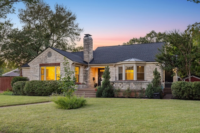 view of front of property with a lawn