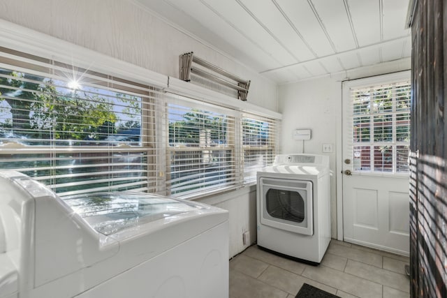 laundry room with light tile patterned floors and washer and dryer