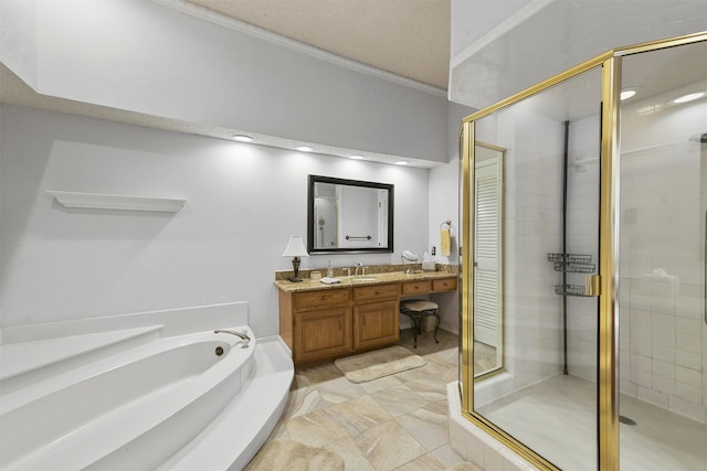 bathroom with vanity, ornamental molding, and independent shower and bath