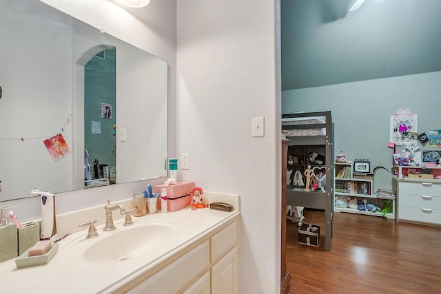 bathroom with vanity and hardwood / wood-style flooring