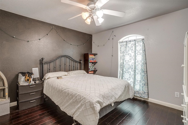 bedroom featuring dark hardwood / wood-style flooring and ceiling fan