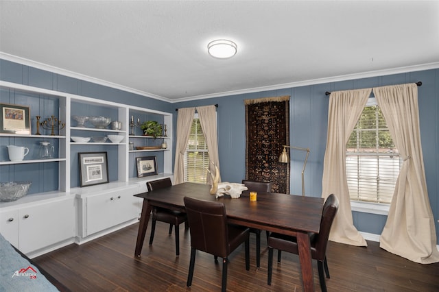 dining room with ornamental molding and dark hardwood / wood-style flooring