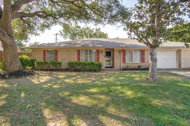 single story home with a front yard and a garage