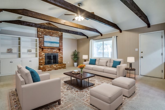 living room featuring light carpet, lofted ceiling with beams, ceiling fan, and a brick fireplace