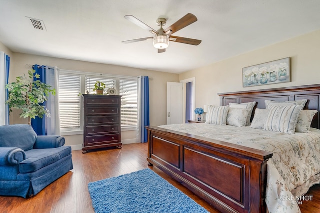 bedroom featuring ceiling fan and hardwood / wood-style flooring