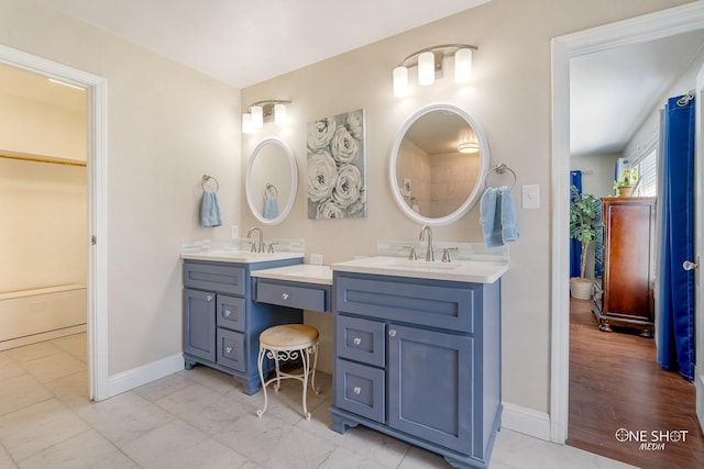 bathroom with hardwood / wood-style flooring and vanity