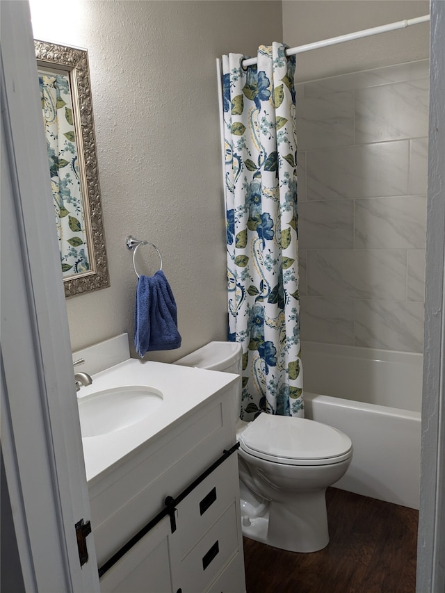 full bathroom featuring shower / tub combo with curtain, vanity, toilet, and hardwood / wood-style flooring