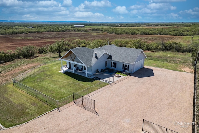 birds eye view of property with a rural view