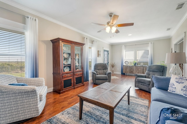 living room with ceiling fan, crown molding, and dark hardwood / wood-style flooring