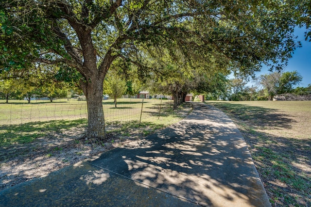 exterior space with a lawn and a shed