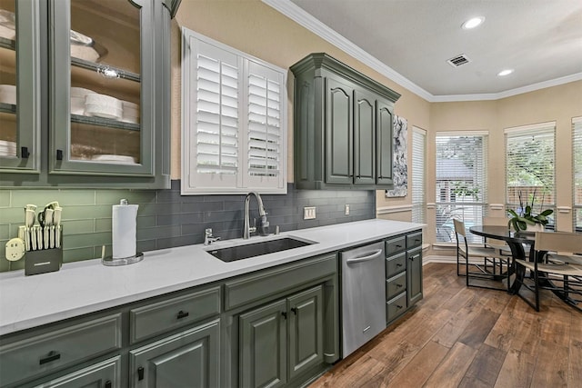 kitchen featuring sink, crown molding, backsplash, dark hardwood / wood-style floors, and stainless steel dishwasher