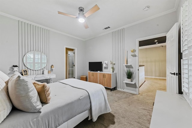 bedroom featuring crown molding, light colored carpet, and ceiling fan