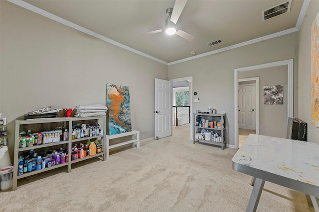 rec room with ornamental molding, carpet, and ceiling fan