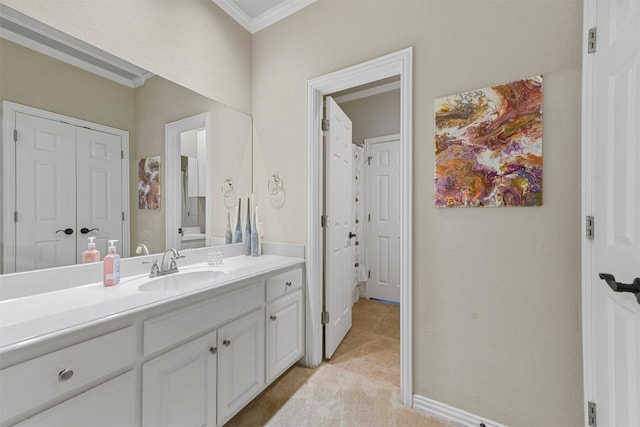 bathroom featuring vanity, crown molding, and tile patterned floors