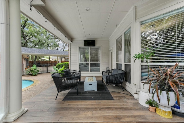 view of patio / terrace with a fenced in pool