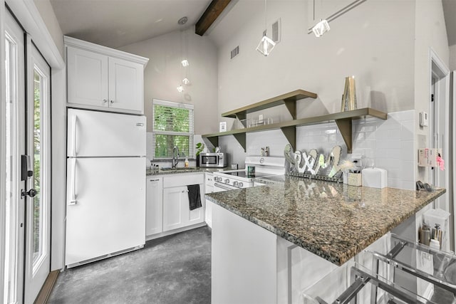 kitchen featuring pendant lighting, sink, white appliances, a breakfast bar, and white cabinets