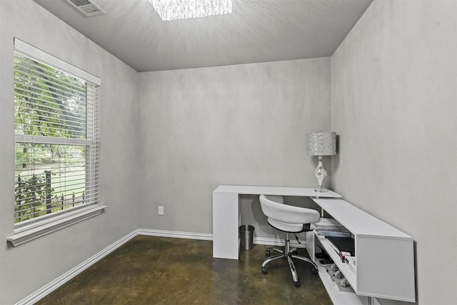 home office with a textured ceiling