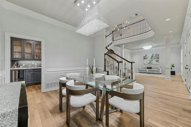 bar with tasteful backsplash, gray cabinetry, hardwood / wood-style floors, and beverage cooler