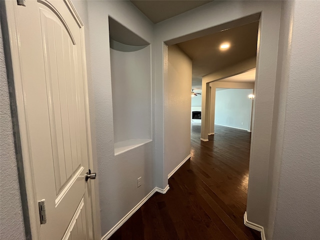 hall with dark hardwood / wood-style floors