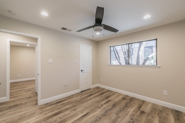 unfurnished bedroom with light hardwood / wood-style floors and ceiling fan