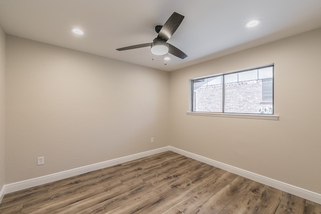 unfurnished room featuring hardwood / wood-style floors and ceiling fan