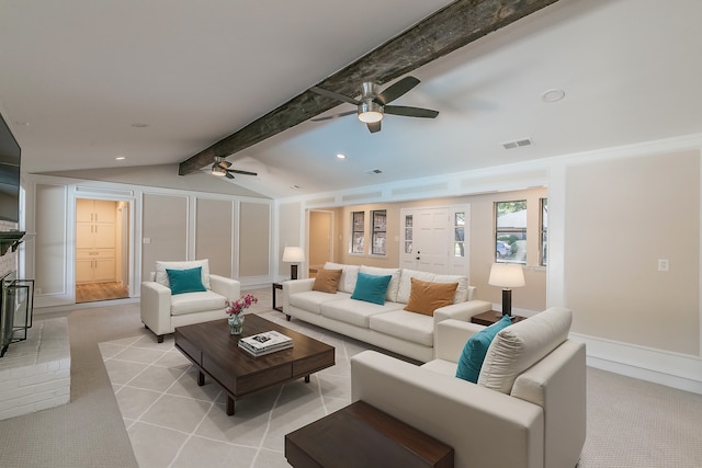 carpeted living room featuring ceiling fan, vaulted ceiling with beams, and a brick fireplace