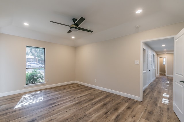 unfurnished room featuring ceiling fan and hardwood / wood-style flooring