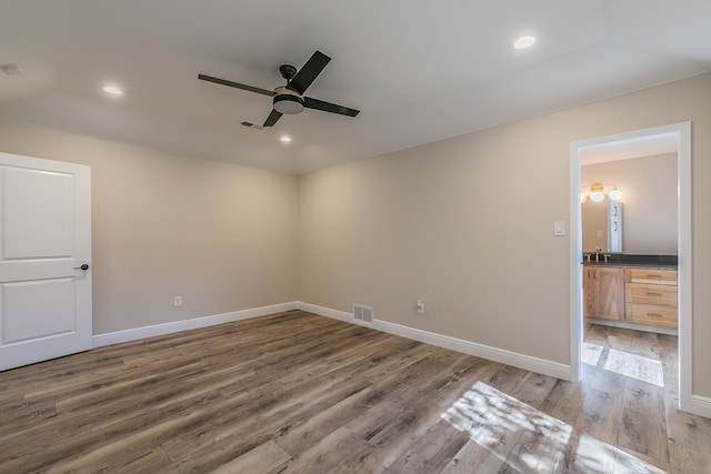 unfurnished room with ceiling fan and dark hardwood / wood-style floors