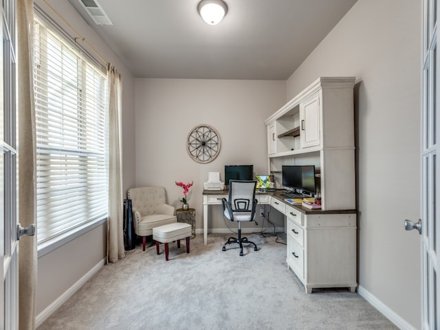 home office with light colored carpet