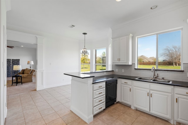 kitchen featuring dishwasher, white cabinetry, a healthy amount of sunlight, and sink